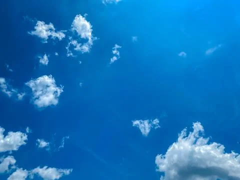 Cloudscape with blue sky and white clouds Stock Photos