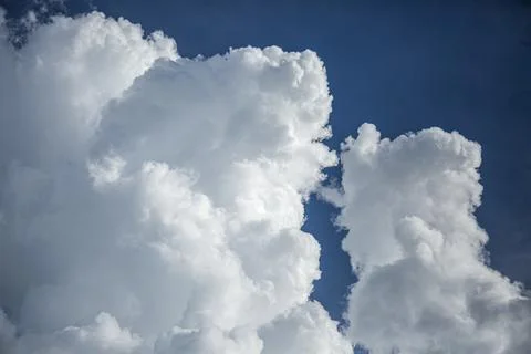 Cloudscape. Blue sky and white cloud. Sunny day. Cumulus cloud. Stock Photos