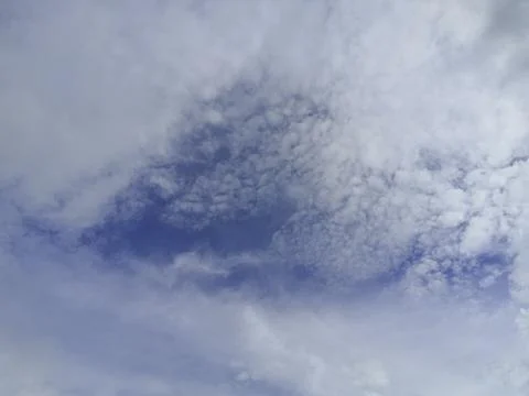 Cloudscape with blue sky and white clouds Stock Photos