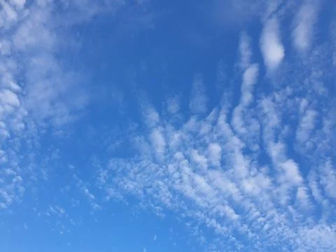 Cloudscape with blue sky and white clouds Stock Photos
