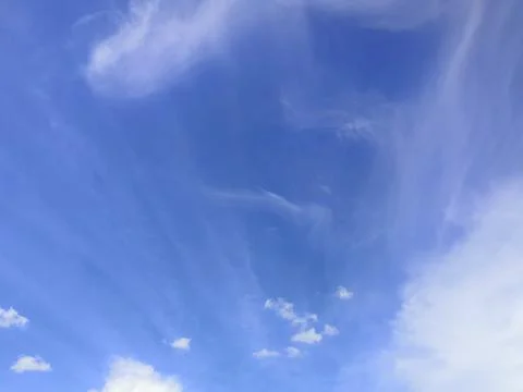 Cloudscape with blue sky and white clouds Stock Photos