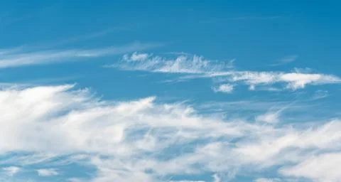 Cloudscape on a blue sunny sky in summer day. Cloudy sky Stock Photos