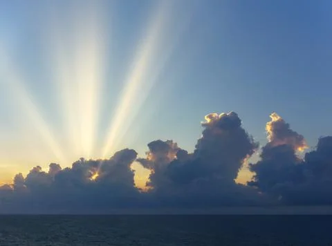 Cloudscape with clouds and beautiful sun rays Stock Photos