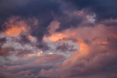 Cloudscape, Colored Clouds at Sunset near the Ocean on a Cloudy Day Stock Photos