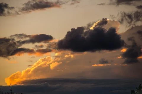 Cloudscape, Colored Clouds at Sunset near the Ocean on a Cloudy Day Stock Photos