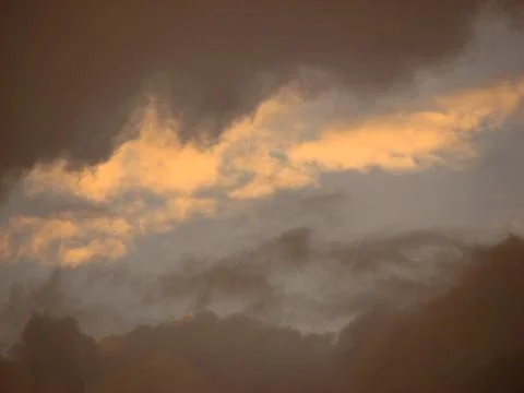 Cloudscape, Colored Clouds at Sunset near the Ocean on a Cloudy Day Stock Photos
