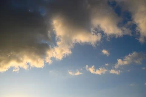 Cloudscape with colorful clouds during sunrise or sunset golden light illum.. Stockfoto's