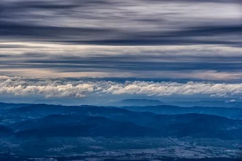 Cloudscape With Cumulus Clouds Above Mountains Photos