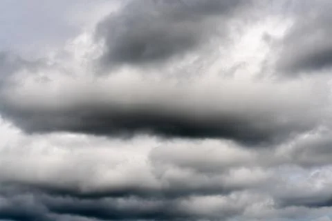 Cloudscape - dramatic clouds floating across sky to weather change before rain Stock Photos
