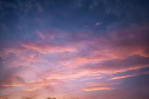 Cloudscape at dusk with red clouds Stock Photos