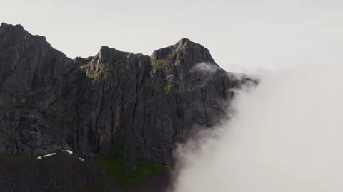 Cloudscape Exploration: Drone's Journey to Mountain Peak on Clear Day Stock Footage 252333383