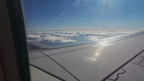 Cloudscape on flight looking out of the window Stock Photos