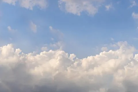Cloudscape fluffy dramatic white cloud on blue sky with copy space Stock Photos