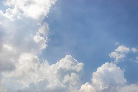 Cloudscape fluffy dramatic white cloud on blue sky with copy space Stock Photos