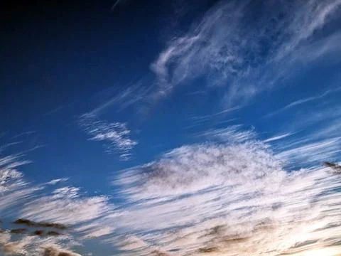 Cloudscape Fluffy White Clouds and Blue Sky Brooding for Background Stock Photos