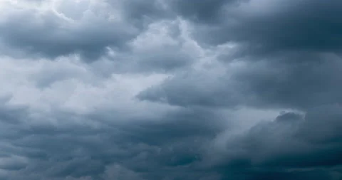 Cloudscape with grey cumulus clouds floating along sky Stock Footage 140328102
