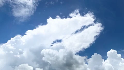 Cloudscape Huge white clouds on bright blue sky on summer season Stock Footage 218339983