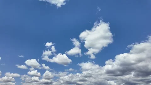 Cloudscape Low Angle View: Evolving Cottony Clouds Under an Intense Blue Sky Stock-Footage 309856428