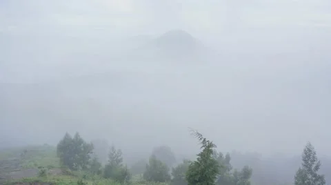 Cloudscape in Mount Prau with view of Mount Sindoro Stock Footage 61909964