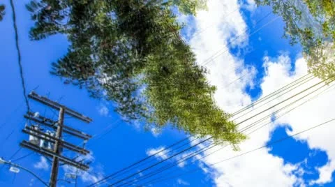Cloudscape moving past trees and power lines Stock Footage 47132631