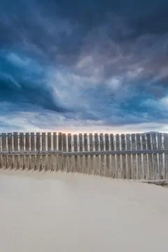 Cloudscape over beach and ocean in Spain, before storm Stock Photos