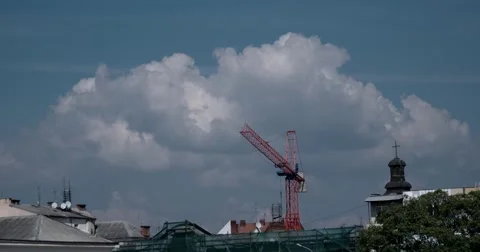 Cloudscape Over the Building Under Construction With Crane in Old City Time 動画素材 67453564