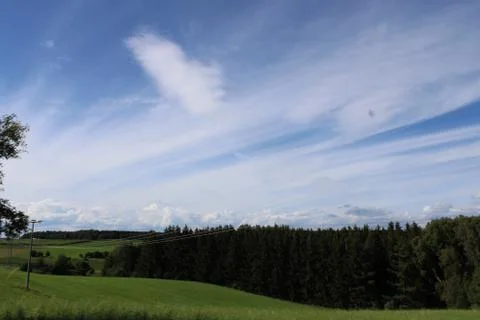 Cloudscape over a forest Stock Photos