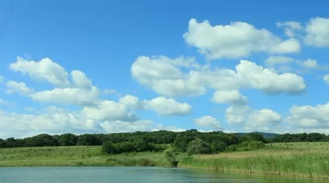 Cloudscape over lake Video stock 22305239
