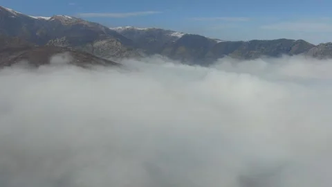 Cloudscape Over Mountain Peaks and Valley Fog Stock Footage 341906186