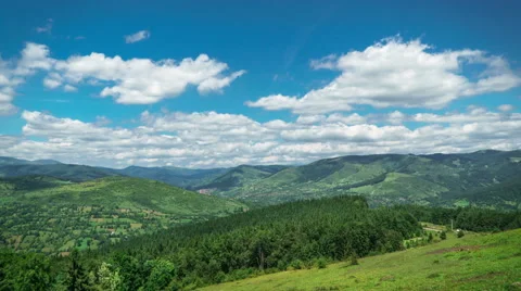 Cloudscape Over Mountain Range and Forest Stock Footage 64953627