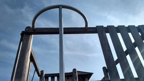 Cloudscape over playground climbing equipment outdoors Stock Photos