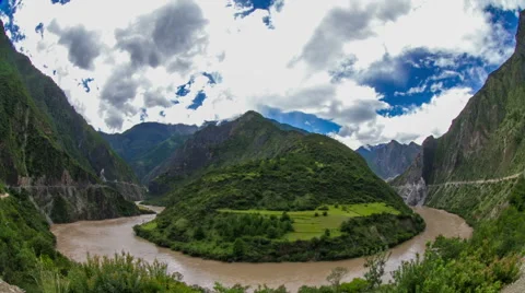Cloudscape over a turbulent-wave river through mountain area. Stock Footage 41129309