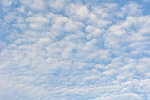 Cloudscape photo of white clouds on blue sky Stock Photos
