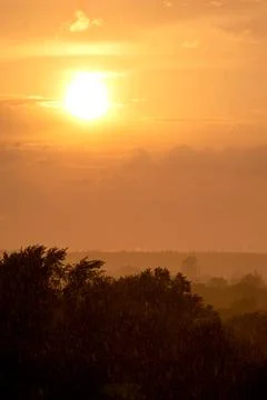 Cloudscape a rainfall at sunset time Stock Photos