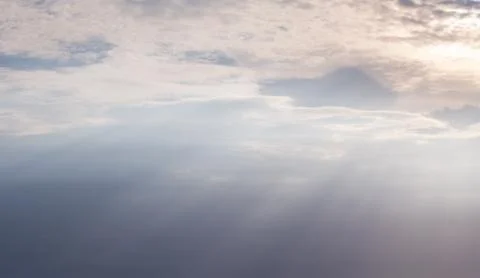 Cloudscape of sky and the light of the sun shines a beam. Stock Photos
