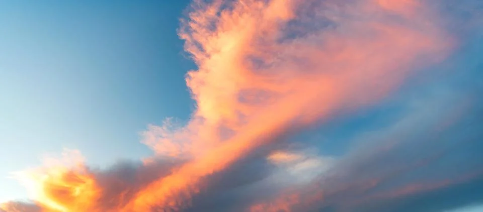 Cloudscape sky on sunset. Cloud in sunset sky. Background with cloud. Dramatic Stock Photos