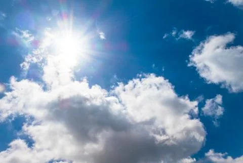 Cloudscape with the sun Stock Photos