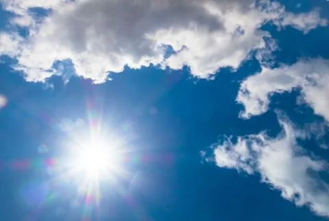 Cloudscape with the sun Stock Photos