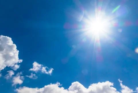 Cloudscape with the sun Stock Photos