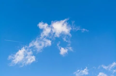 Cloudscape in a sunny day Stock Photos