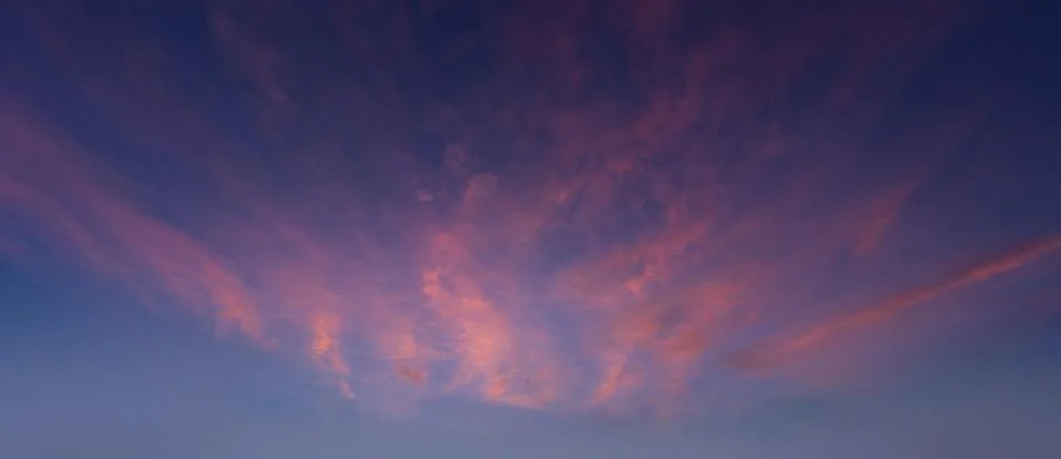 Cloudscape at sunset with red clouds Stock Photos