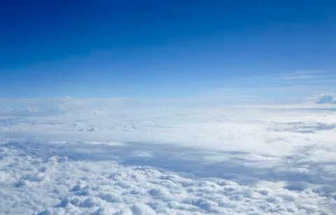Cloudscape through flight window Stock Photos