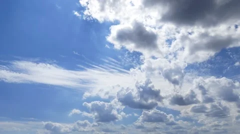 Cloudscape time-lapse 4k video: rolling cumulus clouds moving blue sky sunny day Stock Footage 68637008