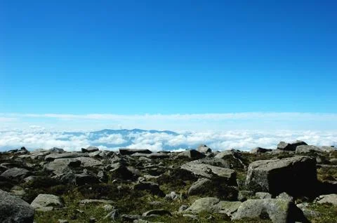 Cloudscape on the top of mountains Stock Photos