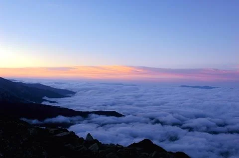 Cloudscape on the top of mountains Stock Photos