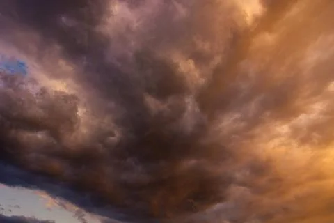Cloudscape view. Dramatic clouds at sunset. Stock Photos