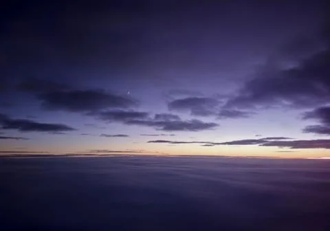Cloudscape viewed from an airplane during sunset Stock Photos