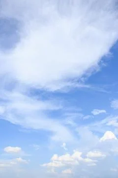 Cloudscape with white clouds and blue sky Stock Photos