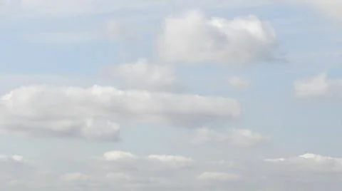 Cloudscape of white clouds floating in azure sky Stock Photos