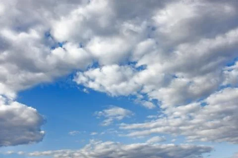 Cloudscape with white clouds Stock Photos
